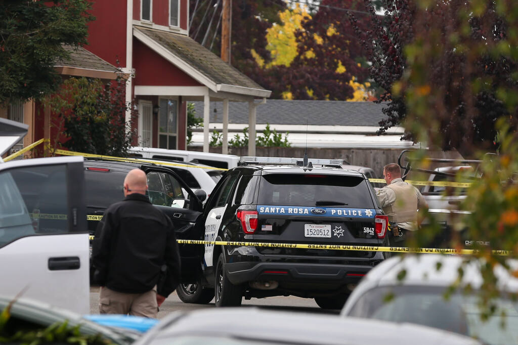 Sonoma County Sheriff's Office personnel investigate a scene on Peach Court in Santa Rosa after a man died in the custody of Santa Rosa police on Thursday, Nov. 18, 2021.  (Christopher Chung/ The Press Democrat)