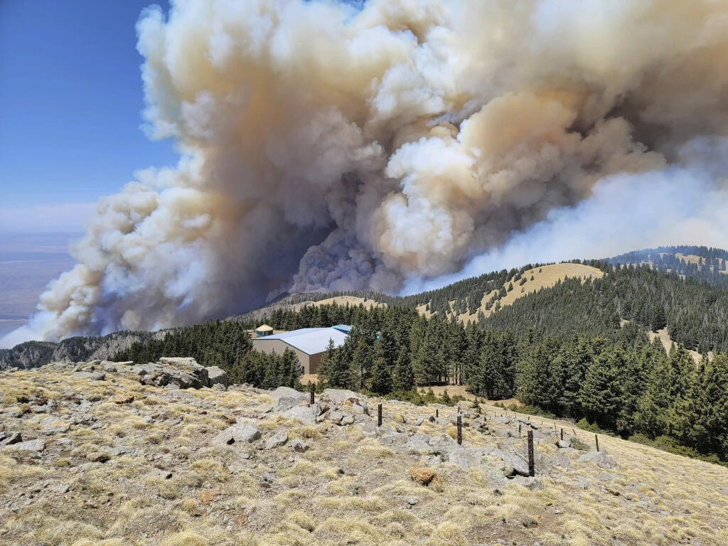 This Monday, April 26, 2021, photo released by USDA Forest Service shows fire progressing in the Lincoln National Forest in N.M.  (USDA Forest Service via AP)