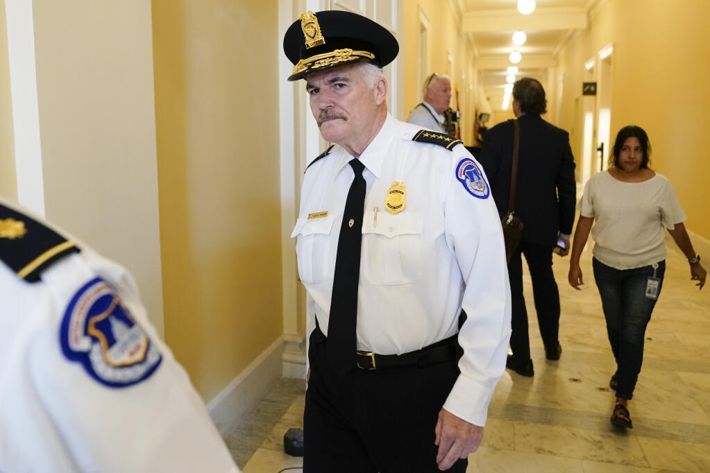 FILE - U.S. Capitol Police Chief Tom Manger walks outside the room where the House select committee investigating the Jan. 6 attack on the U.S. Capitol will hold its first public hearing to reveal the findings of a year-long investigation, Thursday, June 9, 2022, in Washington. A man drove his car into a barricade near the U.S. Capitol early Sunday, Aug. 14, 2022, and then began firing gunshots in the air before fatally shooting himself, police said. Manger said officers did not hear the man say anything before he opened fire “indiscriminately” in the street with a handgun and walked toward the Capitol building. (AP Photo/Andrew Harnik, File)