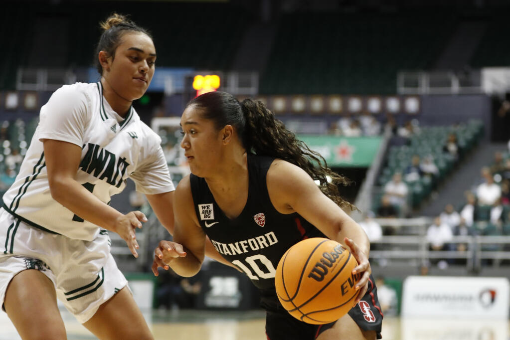 Stanford guard Talana Lepolo (10) tries to get past Hawaii guard Kelsie Imai during the third quarter of an NCAA college basketball game, Sunday, Nov. 27, 2022, in Honolulu. (AP Photo/Marco Garcia)