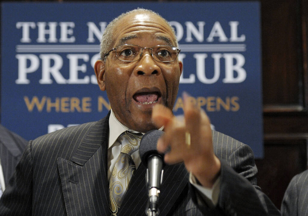 FILE - Rev. Amos Brown, senior pastor of Third Baptist Church, San Francisco, Calif., speaks during a news conference at the National Press Club in Washington, Friday, Sept. 21, 2012. California's first-in-the-nation reparations task force meets in person Wednesday, April 13, 2022, for the first time since its inaugural meeting nearly a year ago. The two-day event will be held at Third Baptist Church in San Francisco's historic Fillmore district. It was once thriving with African American night clubs and shops until redevelopment forced out residents. Its pastor Brown, is task force vice chair and president of the San Francisco chapter of the NAACP. (AP Photo/Cliff Owen,File)