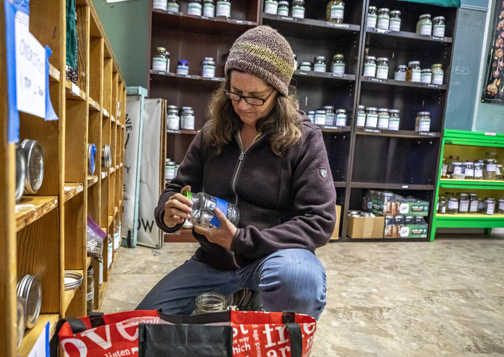 Sara McCamant sorts though donated seeds for the seed library during a work party at the Community Seed Exchange, fosters the free sharing of seeds to promote home growing and biodiversity. The exchange maintains a seed bank and garden at St. Stephen’s Episcopal Church in Sebastopol. Photo taken Wednesday, Feb. 14, 2024  (Chad Surmick / The Press Democrat)