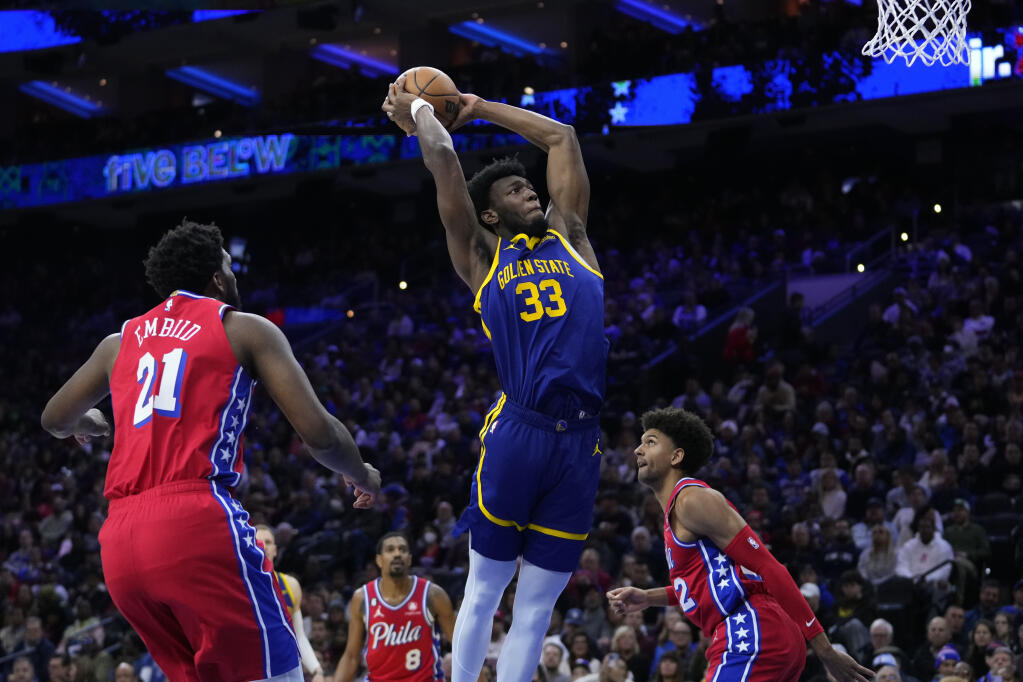 The Warriors’ James Wiseman goes up for a dunk during the first half Dec. 16 against the 76ers in Philadelphia. (Matt Slocum / ASSOCIATED PRESS)