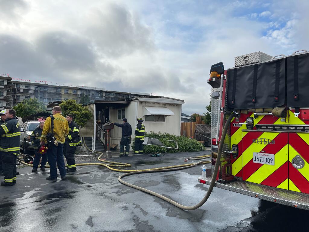 The Santa Rosa Police Department responded to a report of a fire in a mobile home in the 2300 block of Squire Lane, Tuesday, May 30, 2023. The residence was destroyed in the fire and one person was hospitalized. (Madison Smalstig / The Press Democrat)