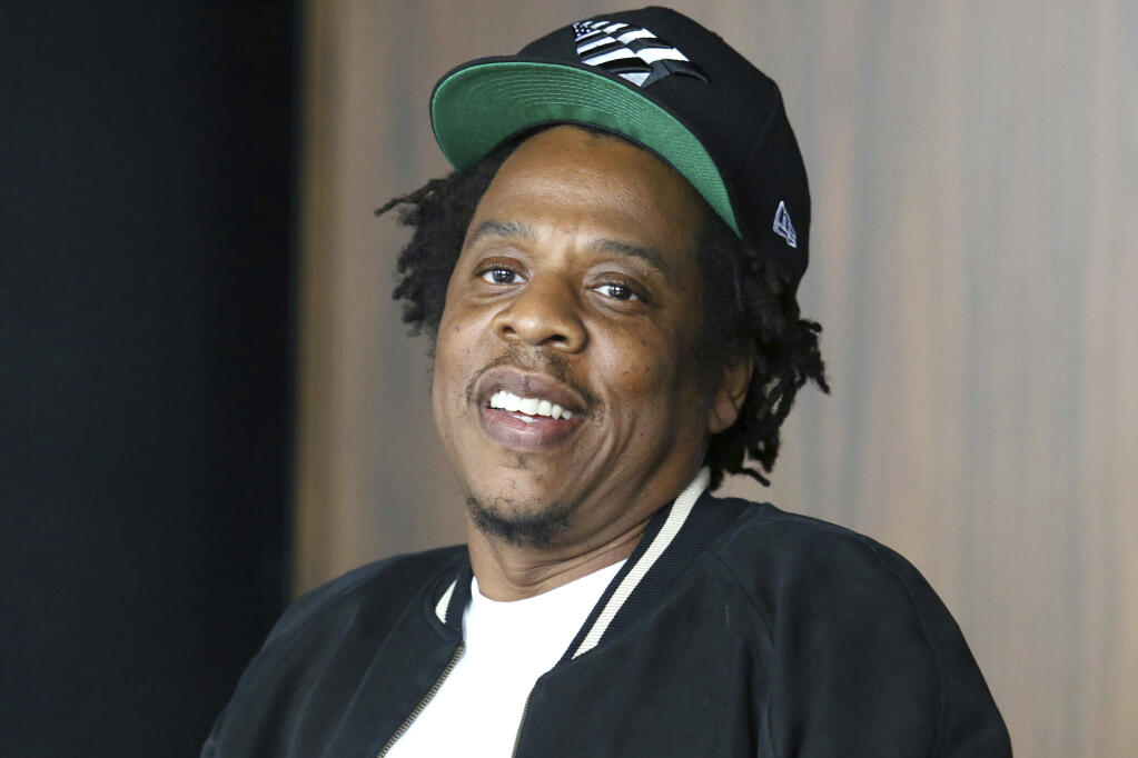 FILE - In this July 23, 2019, file photo, Jay-Z makes an announcement of the launch of Dream Chasers record label in joint venture with Roc Nation, at the Roc Nation headquarters in New York. Financial technology company Square, Inc. says it has reached an agreement to acquire majority ownership of Tidal, the music streaming service partly owned by Jay-Z. (Photo by Greg Allen/Invision/AP, File)