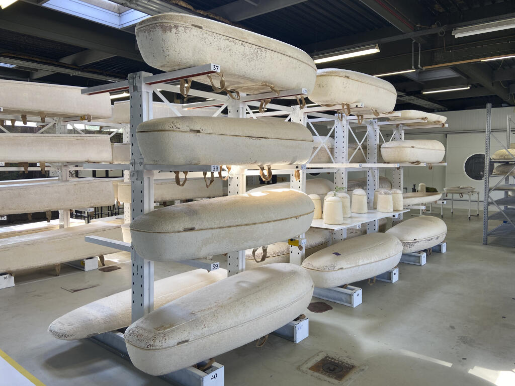 Dutch startup Loop Biotech's cocoon-like coffins, grown from local mushrooms and up-cycled hemp fibres, designed to dissolve into the environment amid growing demand for more sustainable burial practices, are stored in Delft, Netherlands, Monday, May 22, 2023. A Dutch intrepid inventor is now “growing” coffins by putting mycelium, the root structure of mushrooms, together with hemp fiber in a special mold that, in a week, turns into what could basically be compared to the looks of an unpainted Egyptian sarcophagus. (AP Photo/Aleksandar Furtula)