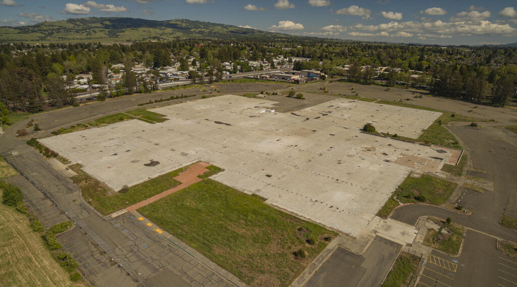 A massive concrete pad is all that remains of the former State Farm building in Rohnert Park. The city of Rohnert Park purchased the site for $12.5 million in April to anchor its long-desired downtown commercial and residential district. (Chad Surmick / The Press Democrat)