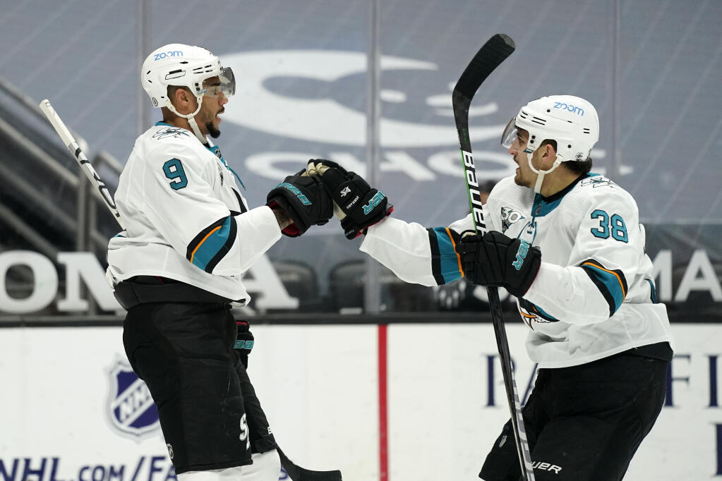San Jose Sharks left wing Evander Kane, left, celebrates his goal with defenseman Mario Ferraro during the first period on Saturday, March 13, 2021, in Anaheim. (Mark J. Terrill / ASSOCIATED PRESS)