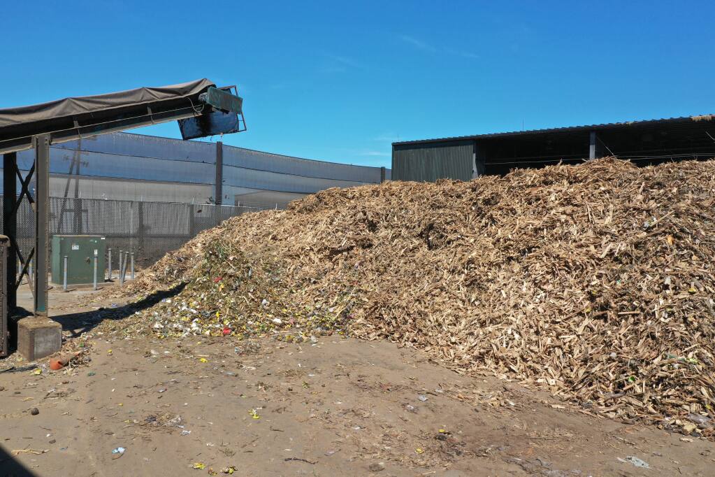 Napa Recycling & Waste Services chips large woody biomass waste that comes into its compost facility. Currently, this must be trucked out of Napa County to burn in biomass  energy plants, but the agency is exploring a $20 million project to turn this woody biomass into renewable gases and biochar, useful in industry and agriculture. (courtesy of Napa Recycling & Waste Services)