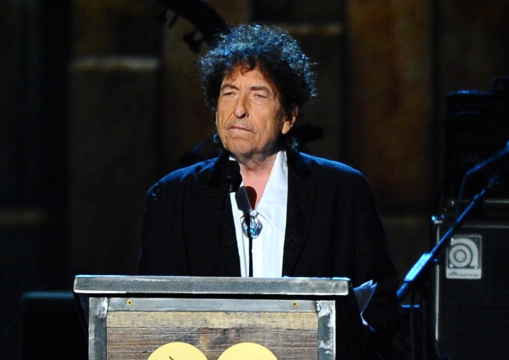 Bob Dylan has a new book out in stores called “The Philosophy of Modern Songs.” He dissects sixty-six American. The book currently sits atop the list of best-selling non-fiction books at our local independent bookseller, Readers Books, but not without controversy.  (Photo by Vince Bucci/Invision/AP)