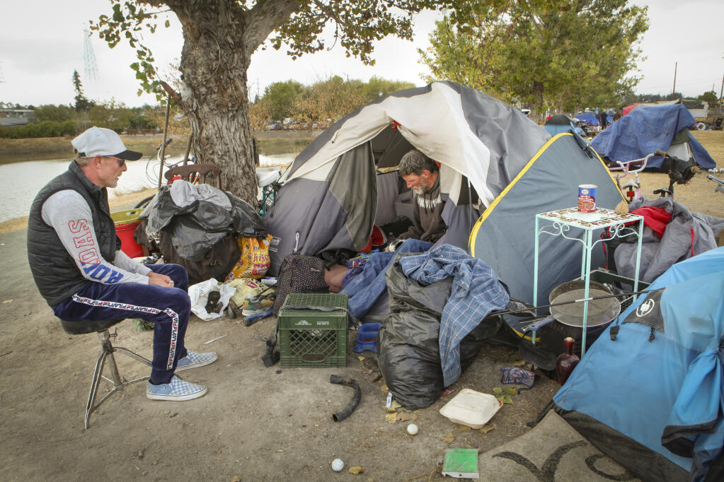 Bradley Brown and Matthew Irving live at the homeless camp in Steamer Landing along the Petaluma River where the police will be clearing out the encampment next month._Monday, Sep. 27, 2021._Petaluma, CA, USA._(CRISSY PASCUAL/ARGUS-COURIER STAFF).