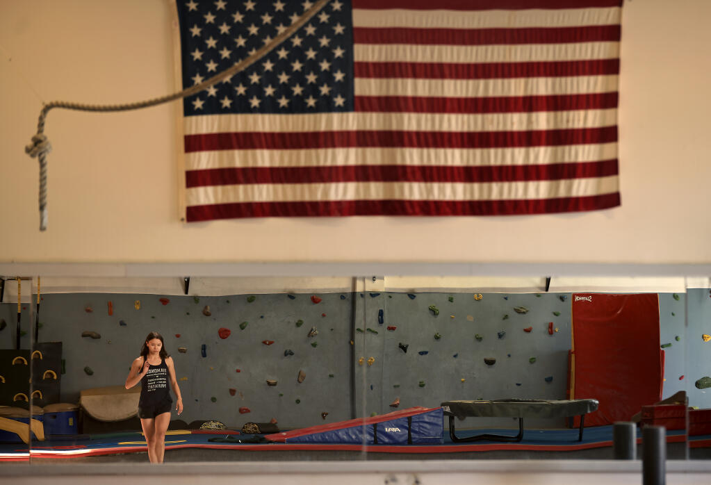 Jennifer Fetzer limbers up at Santa Rosa Gymnastics, Tuesday, July 27, 2021. (Kent Porter / The Press Democrat)
