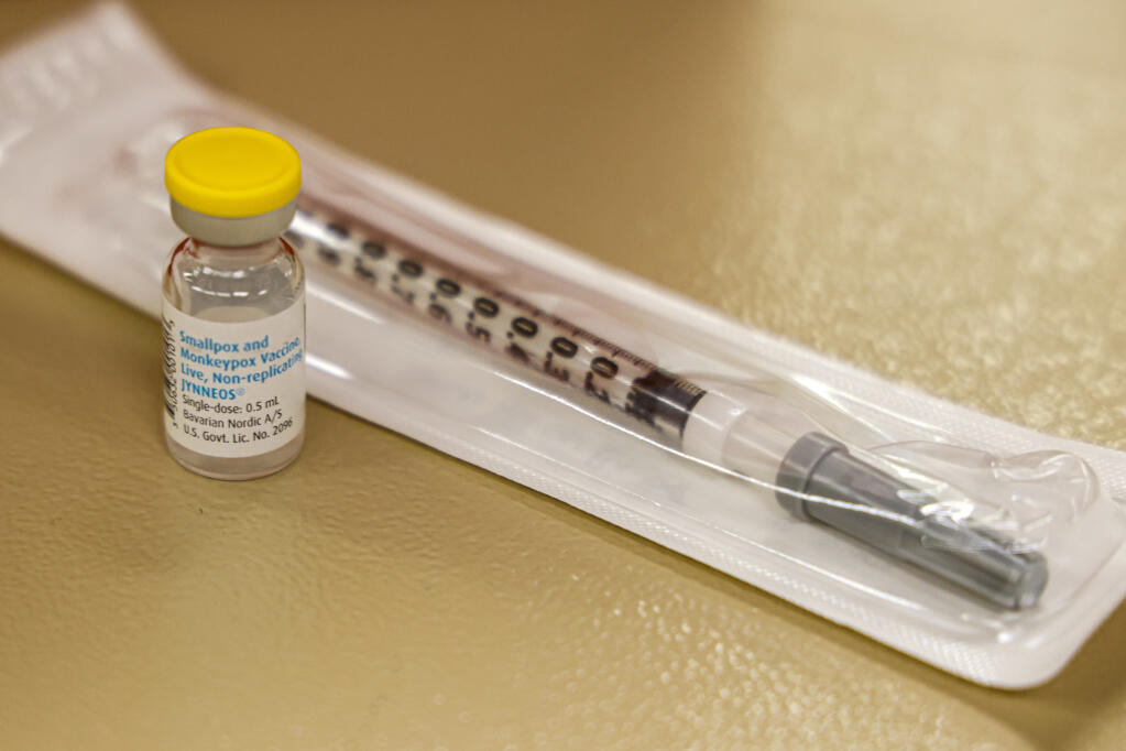 FILE - A vial containing the monkeypox vaccine and a syringe is set on the table at a vaccination clinic run by the Mecklenburg County Public Health Department in Charlotte, N.C., Saturday, Aug. 20, 2022. (AP Photo/Nell Redmond, File)