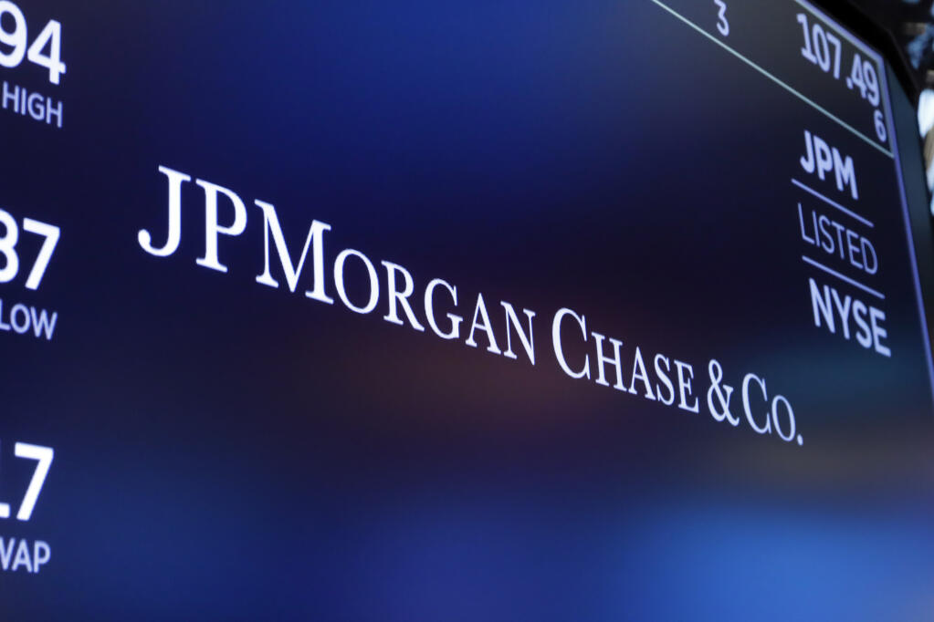 The logo for JPMorgan Chase & Co. appears above a trading post on the floor of the New York Stock Exchange, Friday, Aug. 16, 2019.  (AP Photo/Richard Drew)