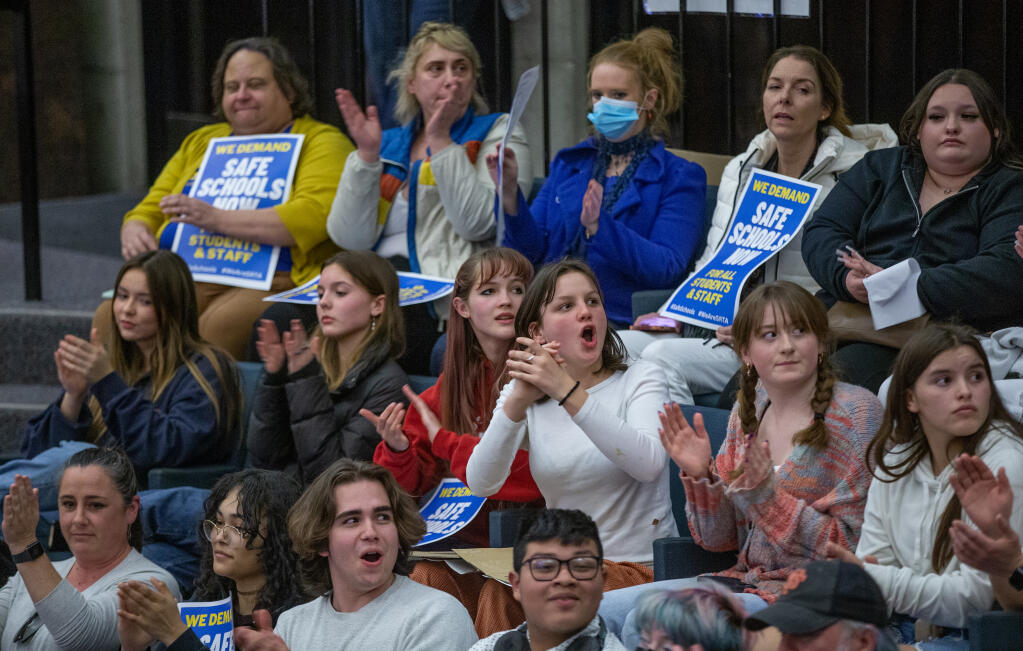 Students cheer a teachers comments during Wednesday’s school board meeting at city hall in support of Montgomery High School after a student fight resulted in the death of a 16-year-old student last week. March 8, 2023 in Santa Rosa. (Chad Surmick / The Press Democrat)