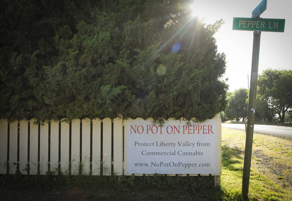 Neighbors of the proposed pot farm on Pepper Road in rural Petaluma put up signs opposing the commercial cannabis grow. (CRISSY PASCUAL/ARGUS-COURIER STAFF)