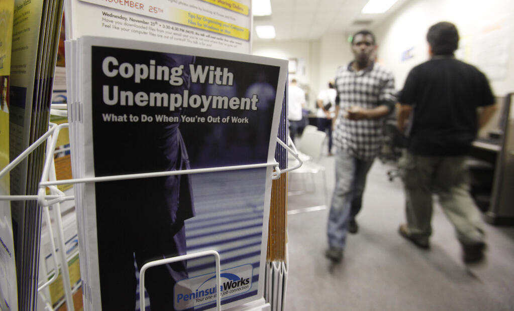 FILE - In this July 20, 2010 file photo, people arrive to seek employment opportunities at a JobTrain office in Menlo Park, Calif.  (AP Photo/Paul Sakuma, File)