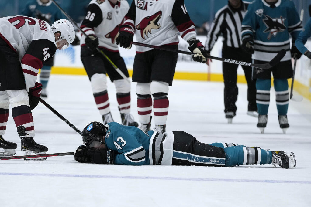 San Jose Sharks left wing John Leonard lies on the ice after colliding with the boards during the first period against the Arizona Coyotes on Friday, May 7, 2021, in San Jose. (Tony Avelar / ASSOCIATED PRESS)