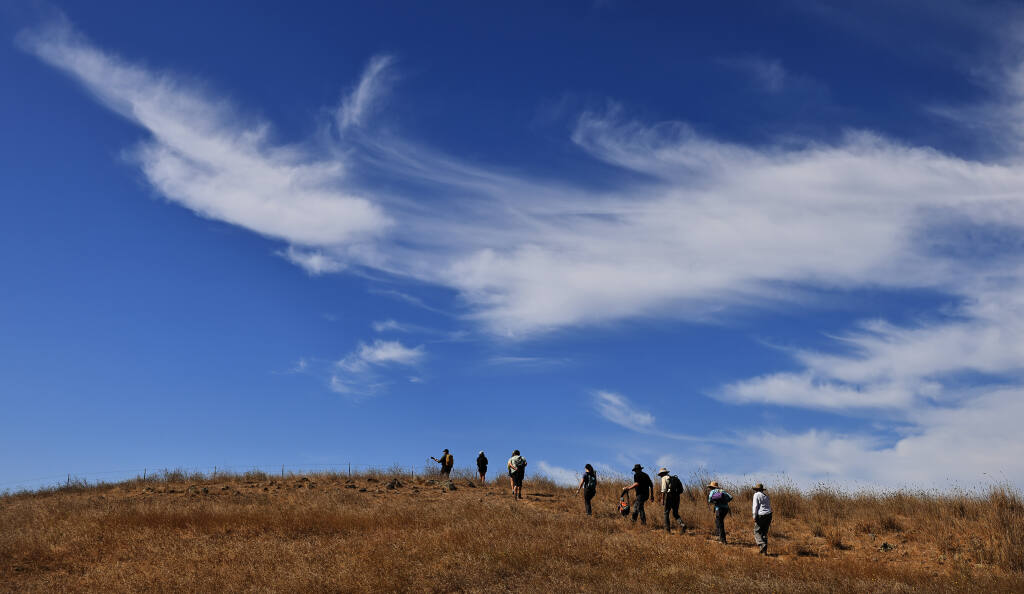 A group of hikers tour the open space of the Lafferty Ranch Saturday, Sept. 17, 2022 in Petaluma. The 270-acre property is owned by the city of Petaluma and has been tied up in land-use disputes for decades. (Kent Porter / The Press Democrat) 2022
