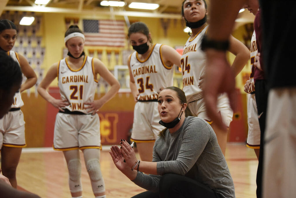 Cardinal Newman coach Monica Mertle with her players during the final minutes of their North Coast Section playoff game against Palo Alto High in Santa Rosa on Tuesday, March 1, 2022. (Erik Castro / for The Press Democrat)