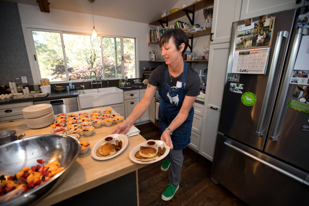 Goatlandia founder and chef, Deborah Blum makes breakfasts during a pancake social at Goatlandia, in Santa Rosa, Calif., on Saturday, Oct. 16, 2021. (Darryl Bush / For The Press Democrat)