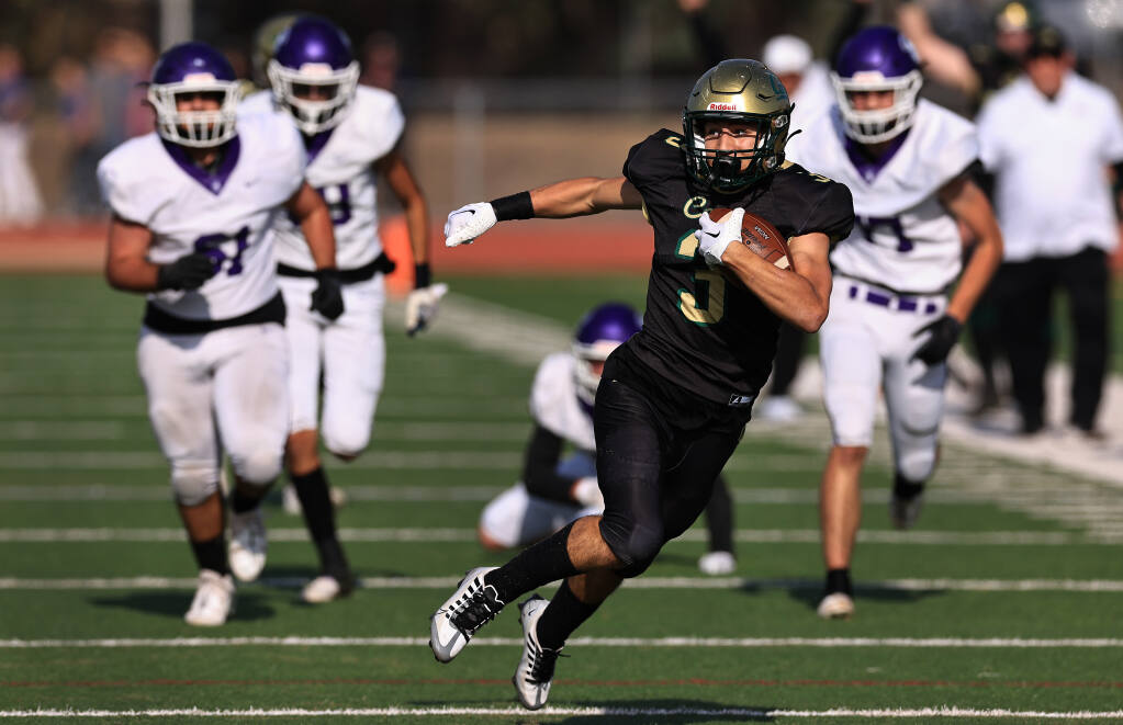 Casa Grande’s Ryder Jacobson takes a screen pass 50 yards for a touchdown against the Petaluma Trojans, Saturday, Oct. 29, 2022 during the Egg Bowl at Casa Grande High School. (Kent Porter / The Press Democrat)