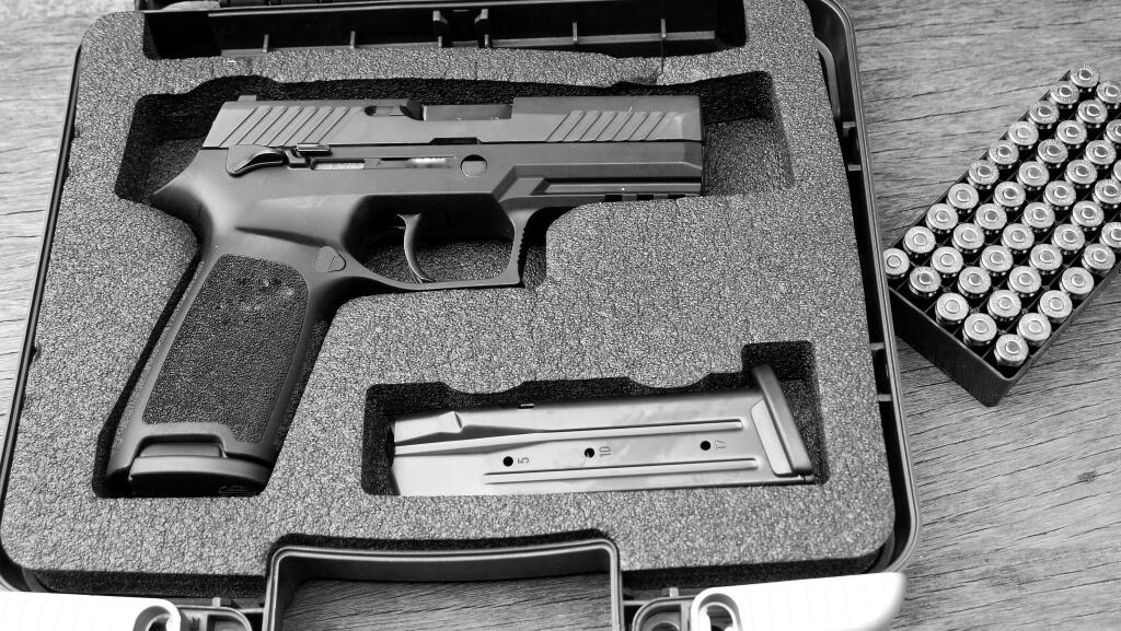 Guns and ammunition in the safe box.