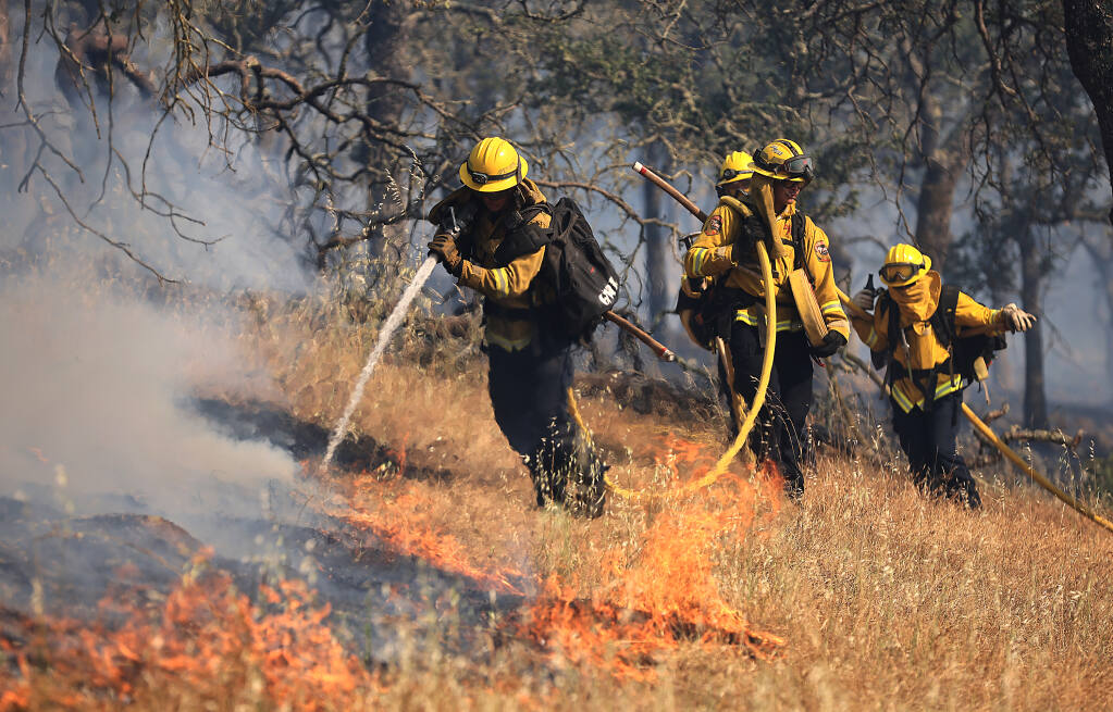Cal Fire and Napa County firefighters knock down the left flank of the Old fire, Tuesday, May 31, 2022, in Napa County (Kent Porter / The Press Democrat)