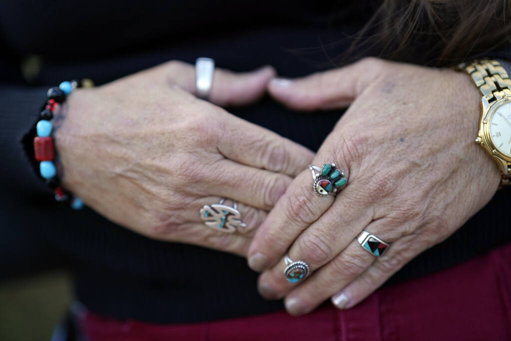 Moonlight Pulido shows some of her Native American jewelry Wednesday, Dec. 7, 2022, in Los Angeles. California is paying reparations to victims, mostly women, who were either forcibly or coercively sterilized by the government. Pulido was sterilized while incarcerated in 2005. (AP Photo/Marcio Jose Sanchez)