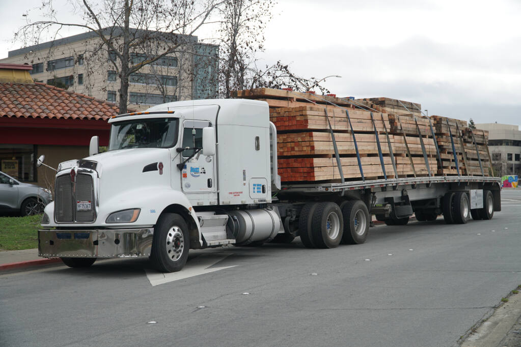 Big rig truck loaded with lumber is parked along a Redwood City, California, roadway on ‎Feb. ‎19. (Michael Barajas / Shutterstock)
