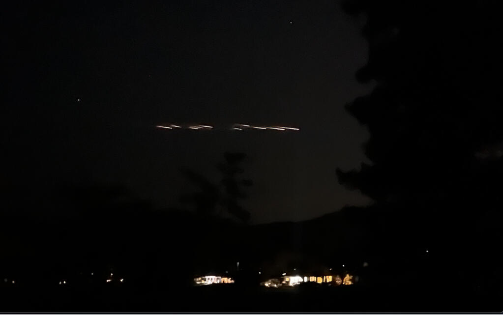 Trailing bright lights are seen streaking across the night sky starting shortly after 9 p.m. from above Oakmont in Santa Rosa. (Bob O’Brien)