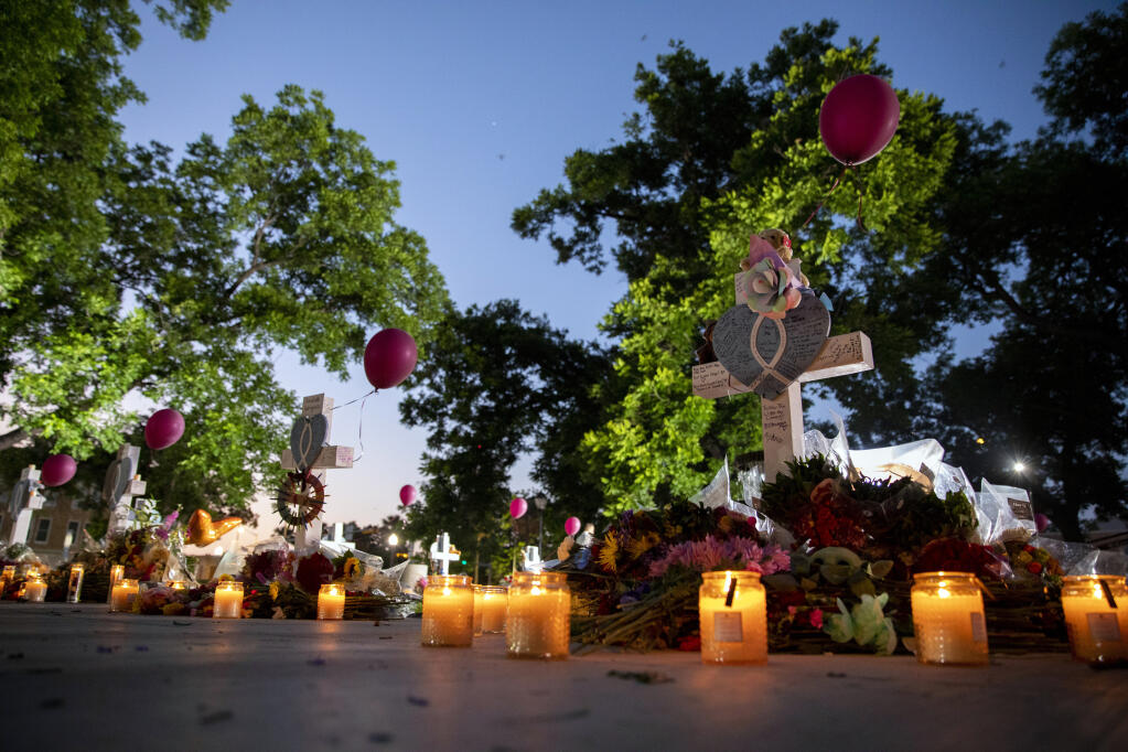 Crosses bearing the names of the victims of the mass shooting at Robb Elementary School at a memorial set up early Friday in the town square in Uvalde, Texas. (Ivan Pierre Aguirre / The New York Times)
