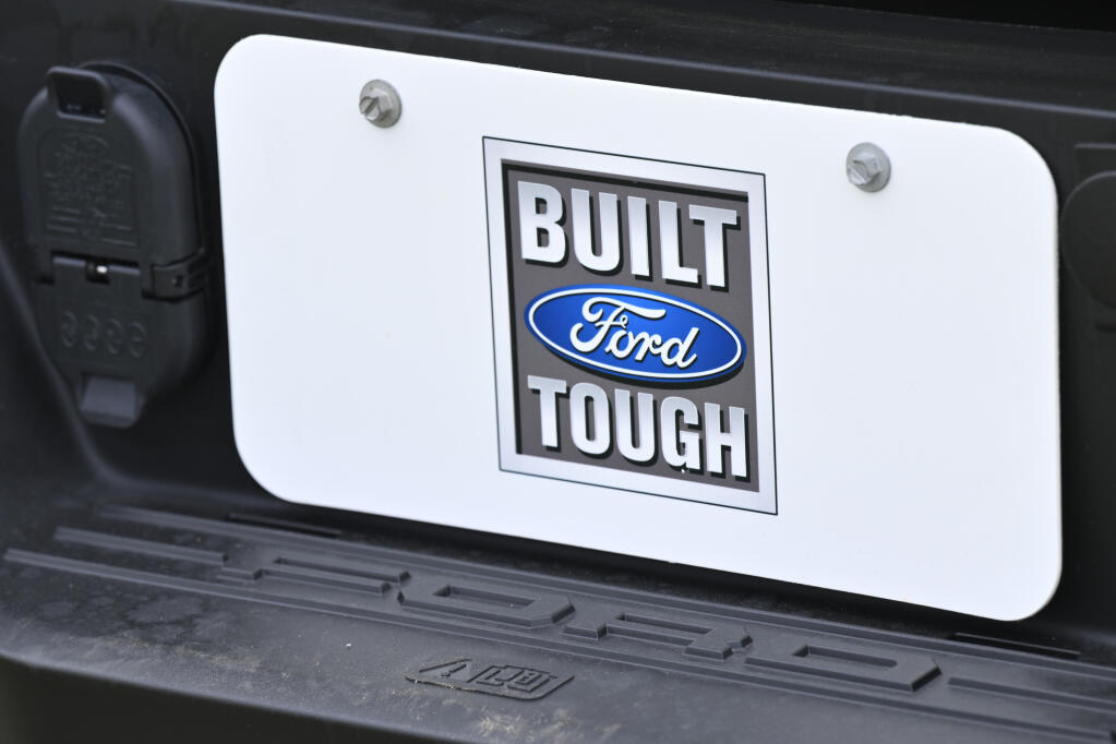A view of license plate holder on a 2022 Ford F-150 Lightning all-electric truck taken during a press conference, Thursday, June 2, 2022, at an assembly plant in Avon Lake, Ohio. (AP Photo/David Richard)