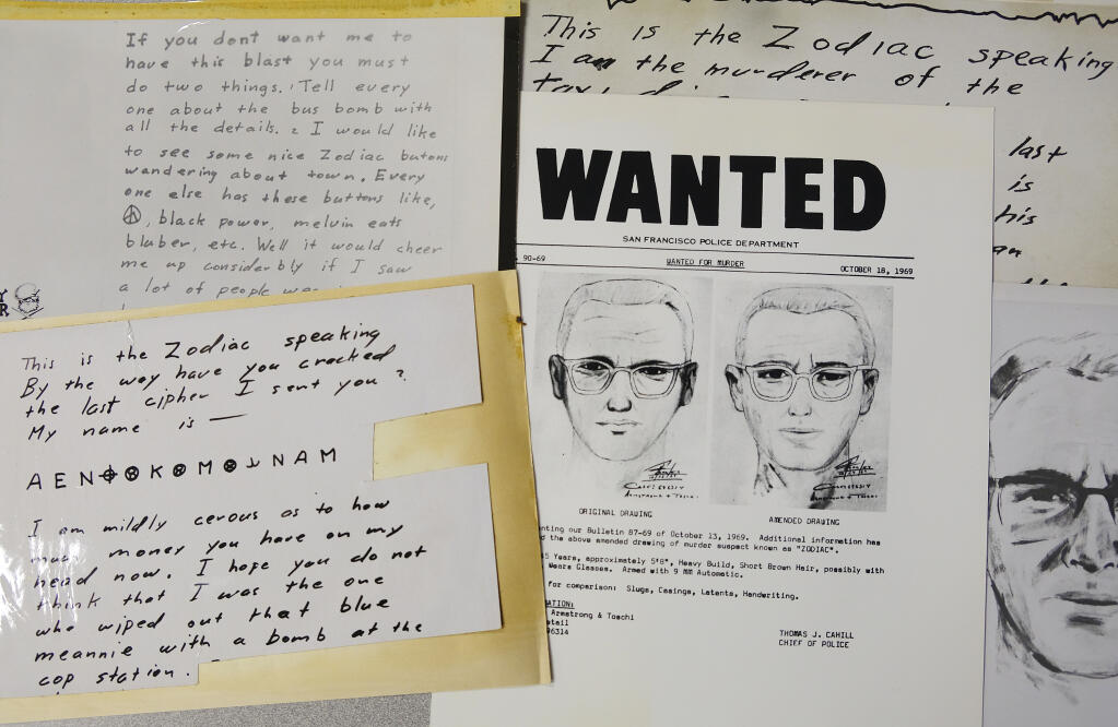 FILE - In this May 3, 2018, file photo, a San Francisco Police Department wanted bulletin and copies of letters sent to the San Francisco Chronicle by a man who called himself Zodiac are displayed in San Francisco. A coded letter mailed to a San Francisco newspaper by the Zodiac serial killer in 1969 has been deciphered by a team of amateur sleuths from the United States, Australia and Belgium, the San Francisco Chronicle reported Friday, Dec. 11, 2020. (AP Photo/Eric Risberg, File)