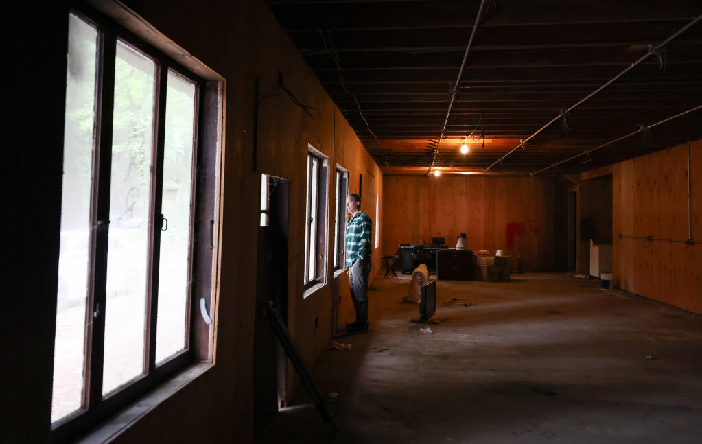 Tim Miller, executive director of West County Community Services, stands in the old George’s Hideaway building near Guerneville, Tuesday, April 23, 2024. The current structures will be torn down so that a new peer mental health center and supportive housing facility can be built on the property. (Christopher Chung / The Press Democrat)