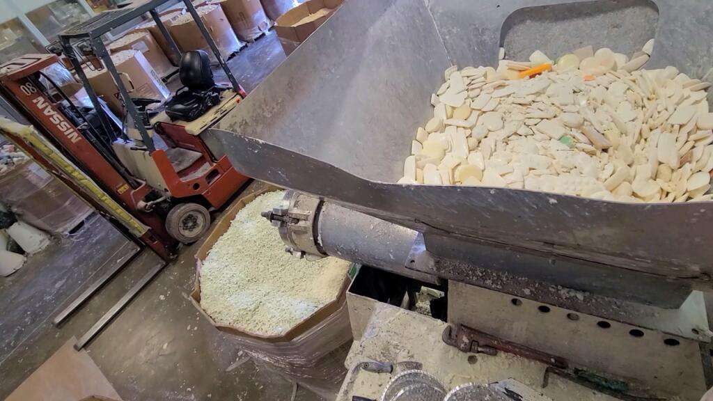 Soap is loaded into a refiner where it will be crushed into tiny pieces.