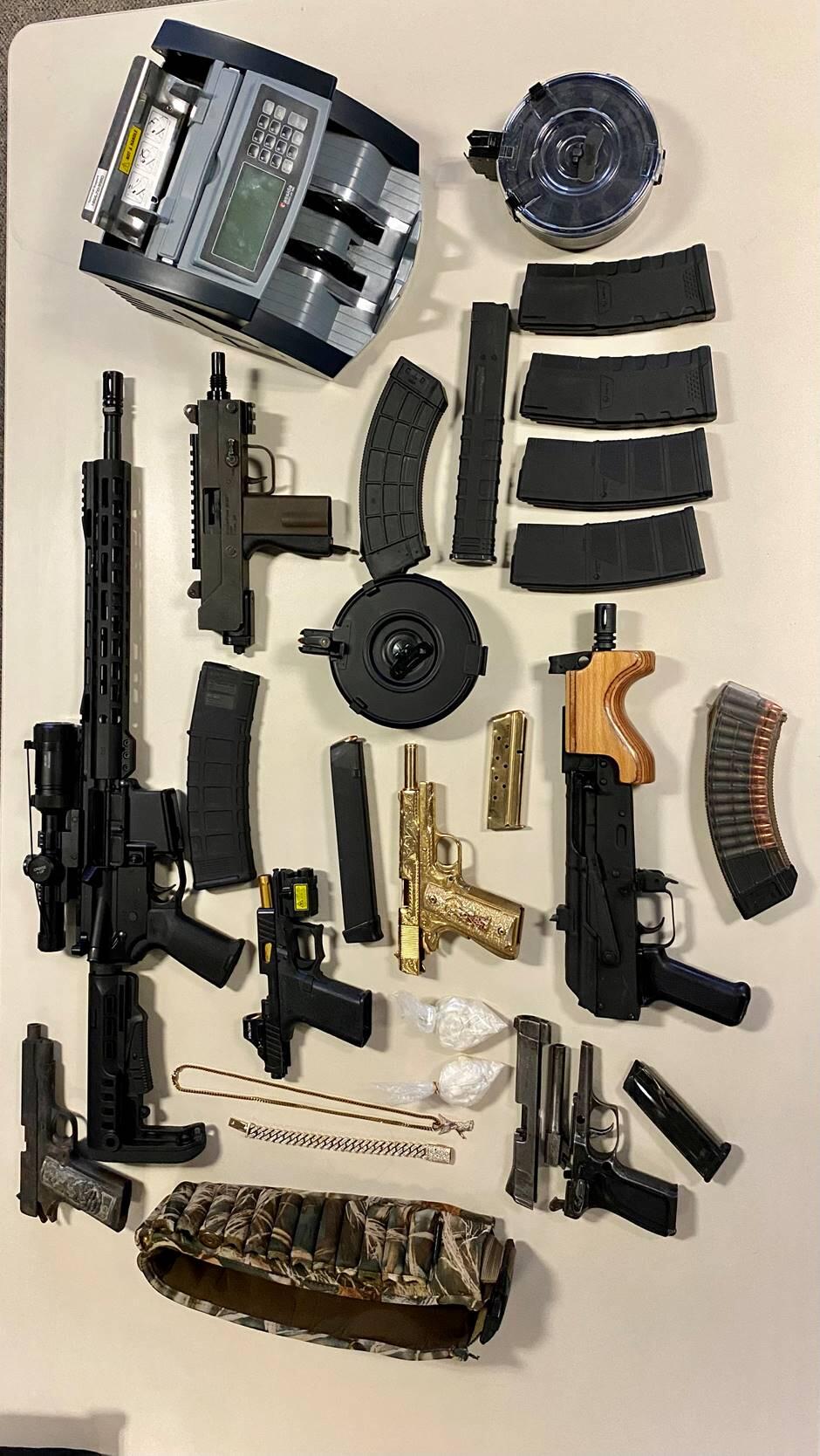 This image shows guns and ammunition Santa Rosa police confiscated during an investigation on Wednesday, Dec. 8, 2021. A Rohnert Park man is suspected of possessing the guns and drug possession. (Santa Rosa Police Department)