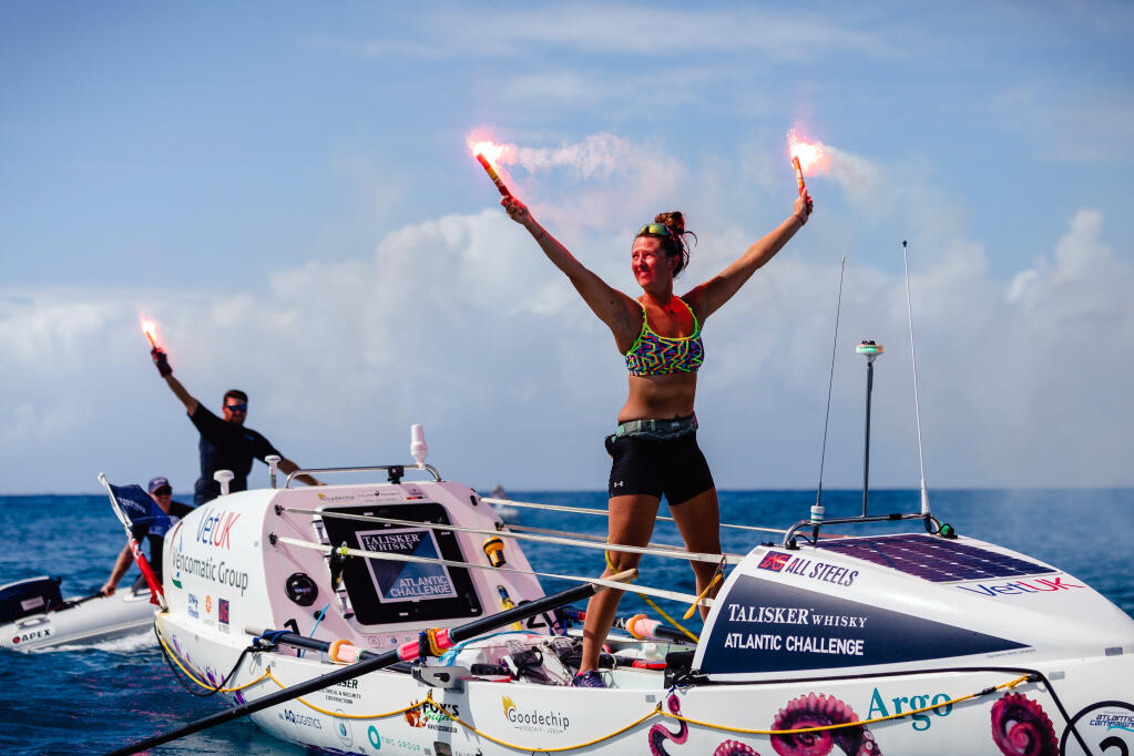 A photo provided by Atlantic Campaigns shows Jasmine Harrison, 21, celebrating after she arrived in English Harbour, Antigua, to set a world record for the youngest female solo rower to row any ocean on Saturday, Feb. 20, 2021. Harrison set off from the Canary Islands and completed the journey in 70 days 3 hours 48 minutes. (Atlantic Campaigns via The New York Times)