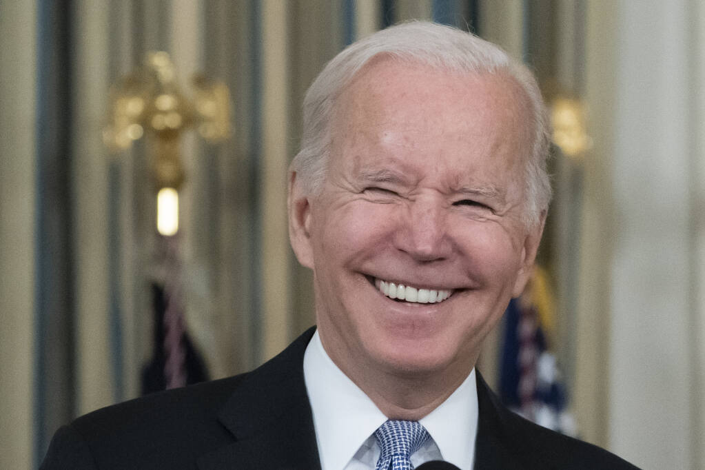 President Joe Biden smiles as he speaks about the bipartisan infrastructure bill in the State Dinning Room of the White House, Saturday, Nov. 6, 2021, in Washington. (AP Photo/Alex Brandon)