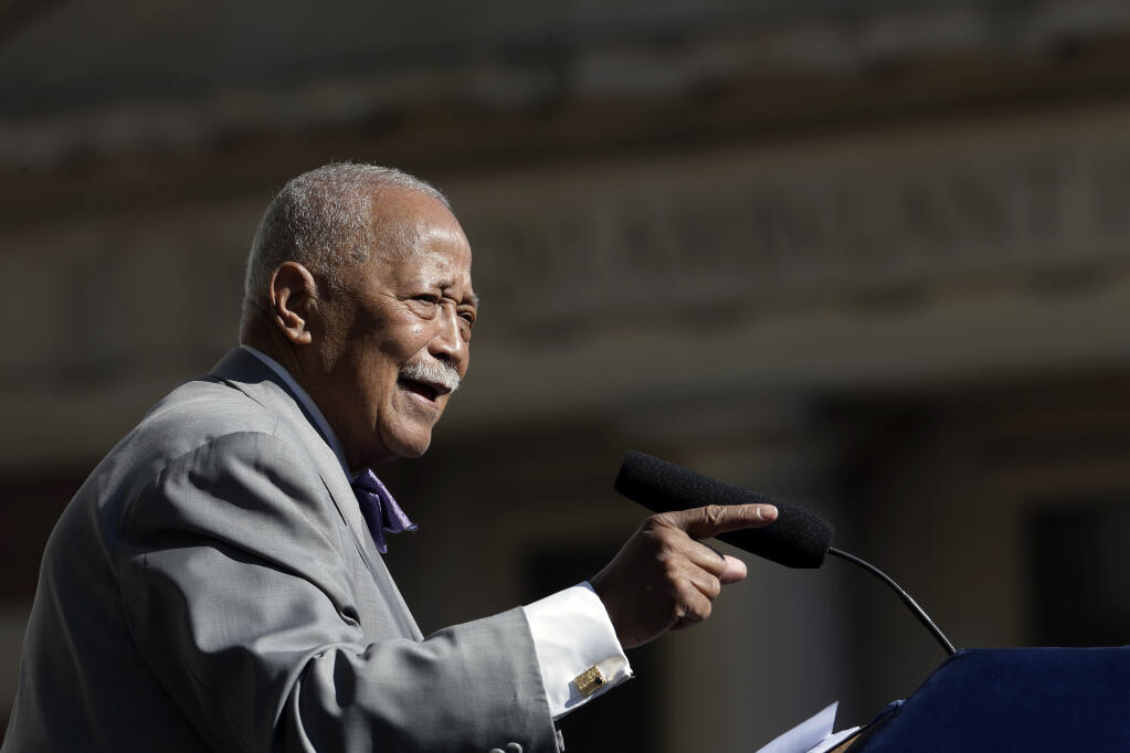 FILE - In this Thursday, Oct. 15, 2015, file photo, former New York City Mayor David Dinkins speaks during a ceremony to rename the Manhattan Municipal Building to the David N. Dinkins Building, in New York. Dinkins, New York City’s first African-American mayor, died Monday, Nov. 23, 2020. He was 93. (AP Photo/Mary Altaffer, File)