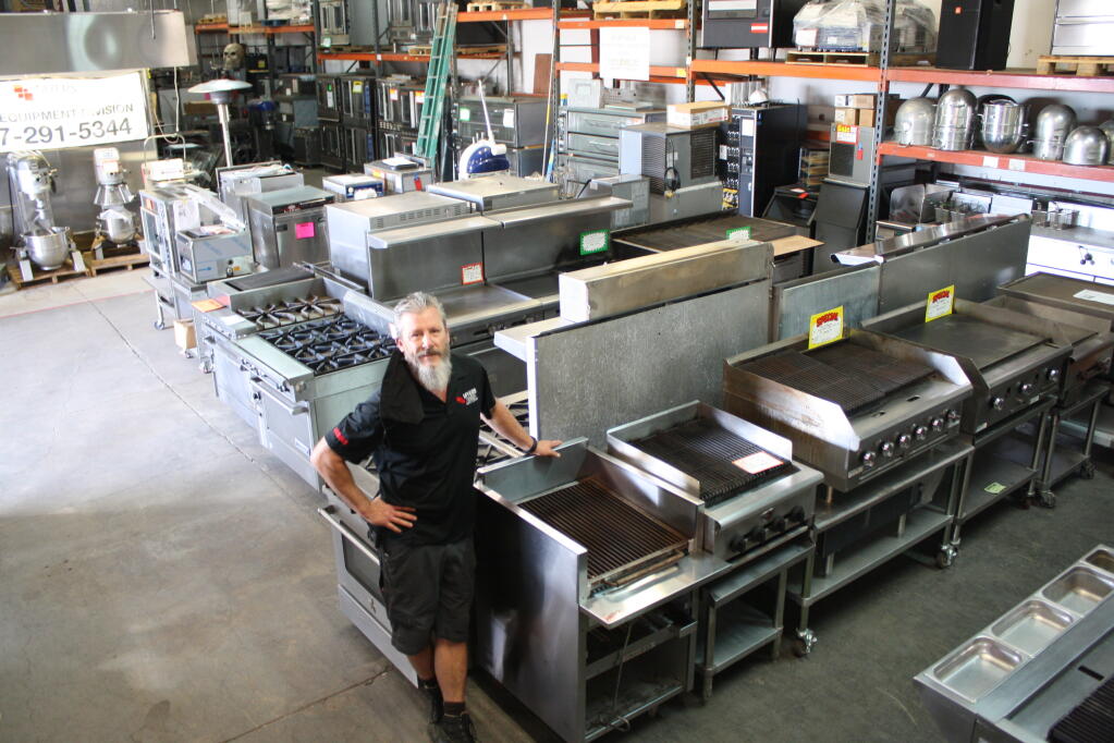 Restaurant owners wishing to sell or consign equipment in the North Bay turn to Myers Foodservice Equipment Supply. This company has hundreds of used commercial kitchen stoves, grills, refrigerators, freezers and other equipment in  Santa Rosa. Steve Grothe, used equipment division manager, stands next to a line of like-new, fully operational stainless steel ovens and grills in the 100,000-square-foot warehouse on March 1. (Gary Quackenbush / for North Bay Business Journal)