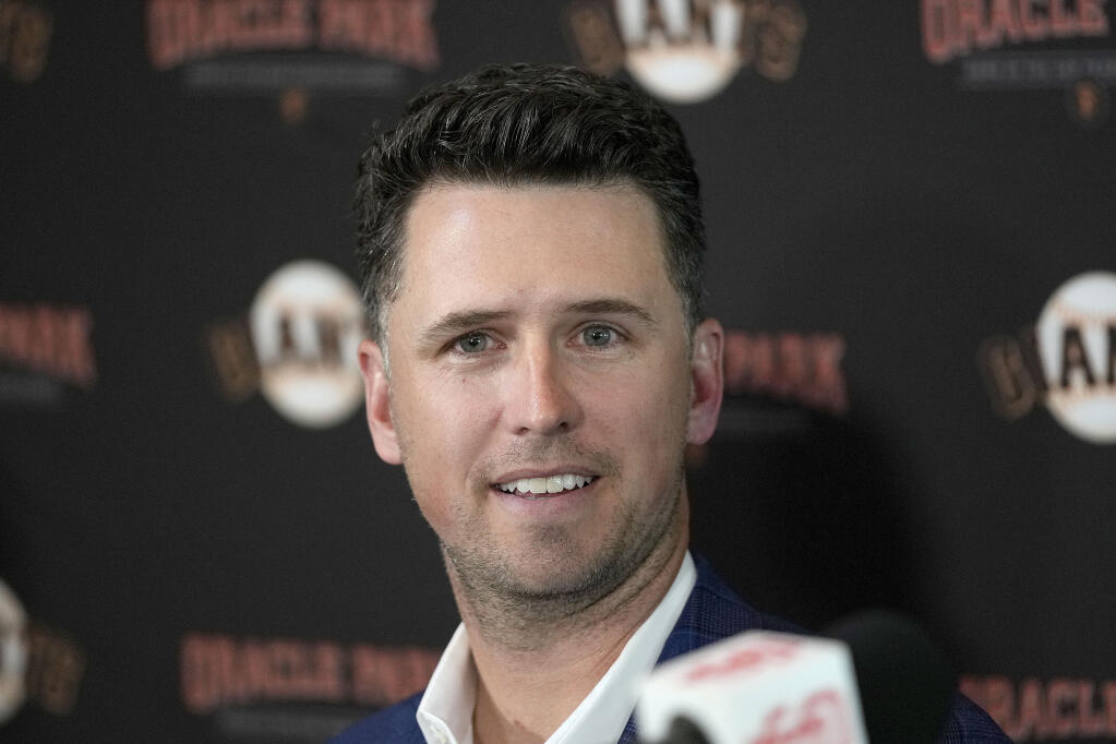 San Francisco Giants catcher Buster Posey talks during a news conference announcing his retirement from baseball, Thursday, Nov. 4, 2021, in San Francisco.  (AP Photo/Tony Avelar)