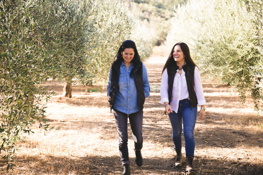 Mother-daughter team, Ana and Marcela Hernandez, walk the grounds of their Grove 45 Olive Oil farm in St. Helena. (Margaret Nissen photo)