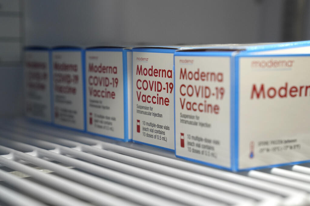 Boxes of Moderna COVID-19 vaccine are stored in a refrigerator at an ambulance company in Santa Fe Springs,  Saturday, Jan. 9, 2021. (Jae C. Hong / Associated Press)