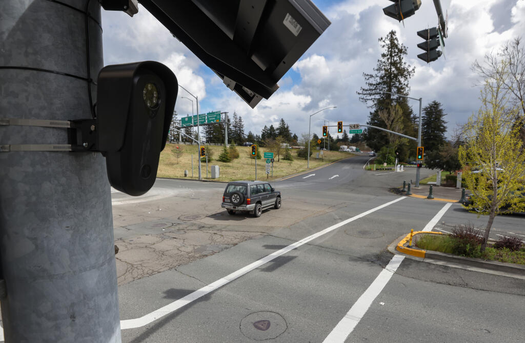 A license plate reader mounted to a traffic light post, on the corner of Third and Davis streets, in Santa Rosa on Thursday, April 4, 2024. (Christopher Chung/The Press Democrat)