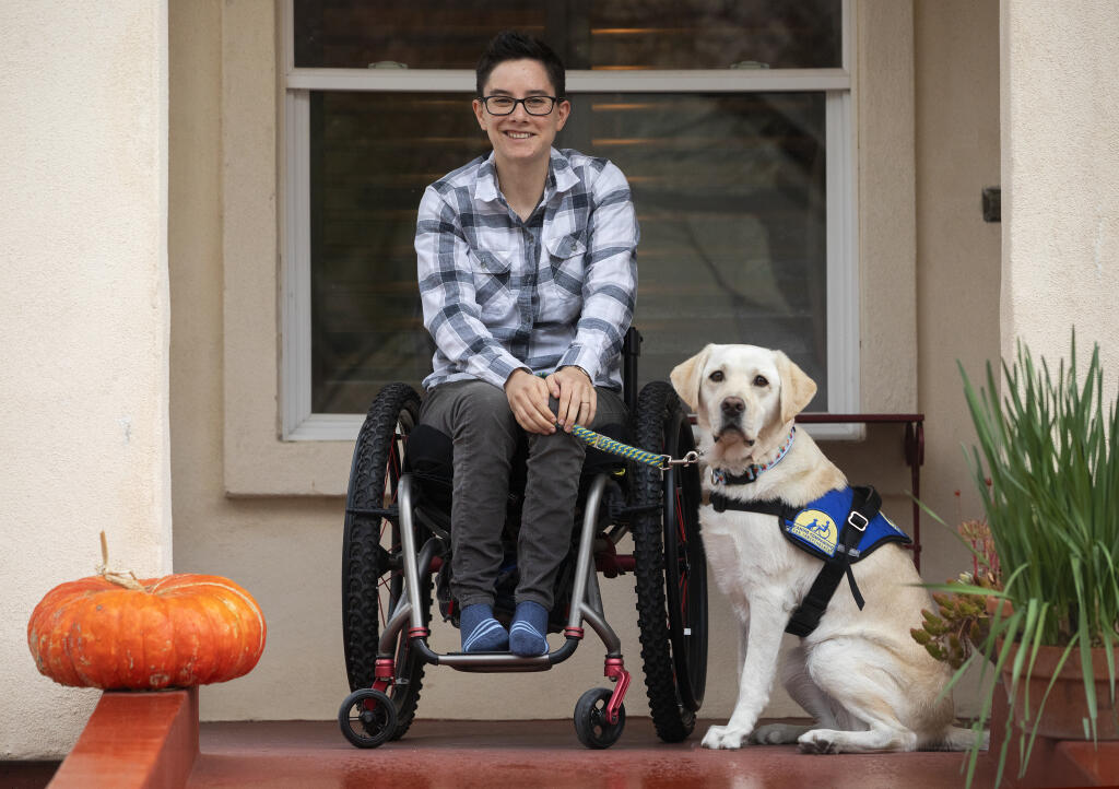 Wallis Brozman and her dog Renata work for and graduated from Canine Companions for Independence in Santa Rosa. Brozman lobbied for a new rule limiting emotional support animals on flights with the same free rein as trained service animals. Photo taken on Friday, Dec. 11, 2020.  (John Burgess/The Press Democrat)