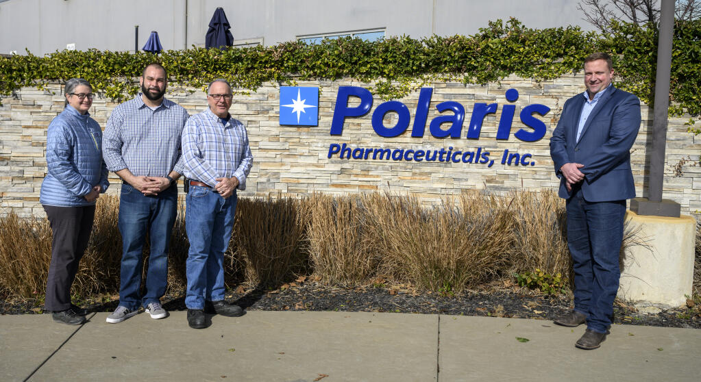 Vacaville Mayor Ron Rowlett, right, meets with Polaris Pharmaceuticals Vacaville officials, from left,  principal engineer Mary Scomona, Business Development Manager Jose Ortiz and Facility Director Matt Mitchell on Jan. 26, 2022, in front of the company’s existing facility in the city. (Cory Booth photo)