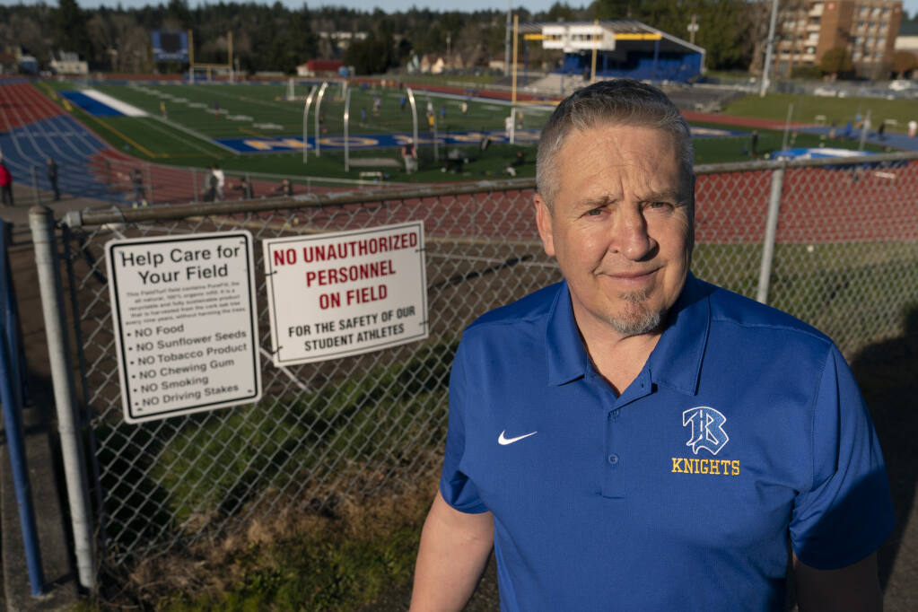 Joe Kennedy, a former assistant football coach at Bremerton High School in Bremerton, Wash., poses for a photo March 9, 2022, at the school's football field. (Ted S. Warren / ASSOCIATED PRESS)