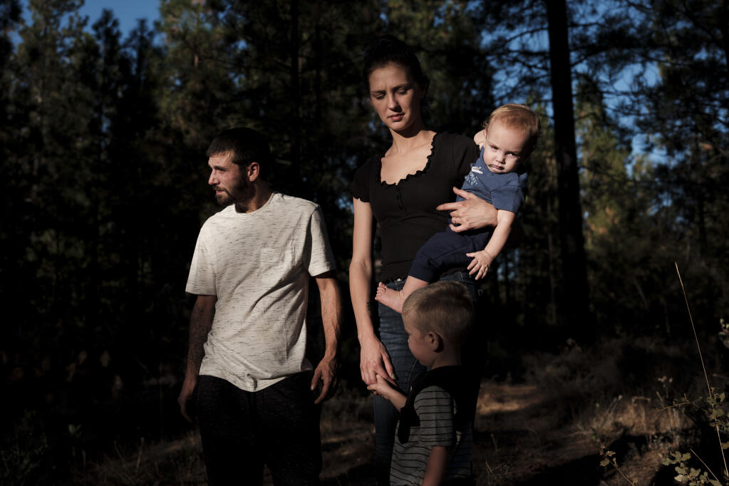 Kristin Jeffcoat with her husband, Richard Musa, and their children at their home in Camptonville, Calif., Oct. 13, 2020. When schools closed in the spring, Jeffcoat, an Instacart shopper, stayed home to watch their children, and then her husband got laid off from landscaping work. (Max Whittaker/The New York Times)