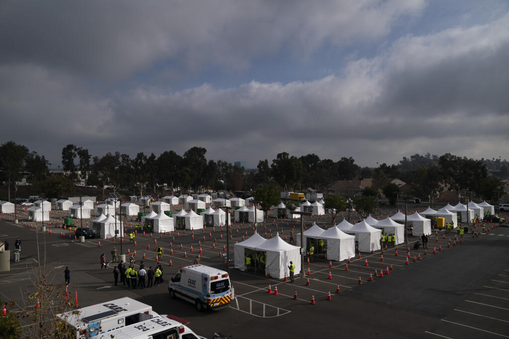 A federally-run COVID-19 vaccination site is seen on the campus of California State University of Los Angeles in Los Angeles, Calif., Tuesday, Feb. 16, 2021. (AP Photo/Jae C. Hong)